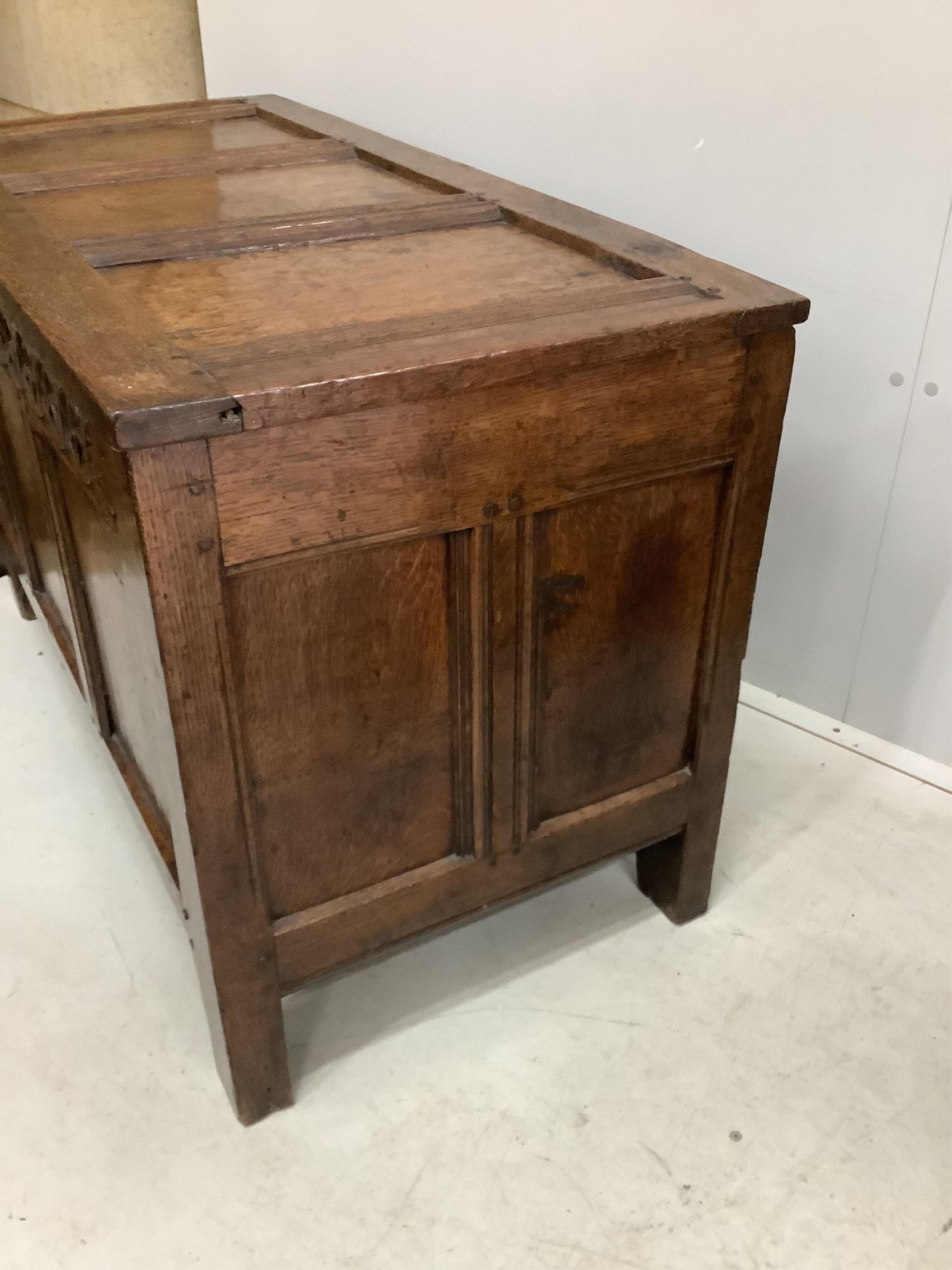 A 17th century oak coffer, width 112cm, height 68cm. Condition - fair to good